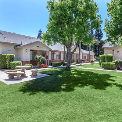 Outdoor area with green lawn and walking paths