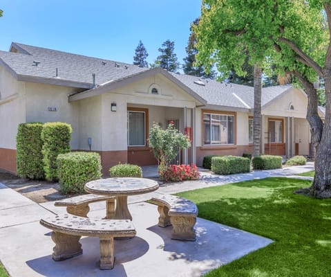 Outdoor view of Brookside Senior Apartments with landscaping