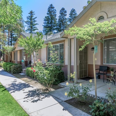 Exterior view of senior apartments with garden