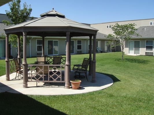 Gazebo in a grassy outdoor area of a facility