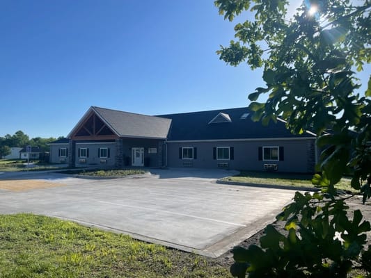 Front view of Sunflower Care Homes building with clear sky