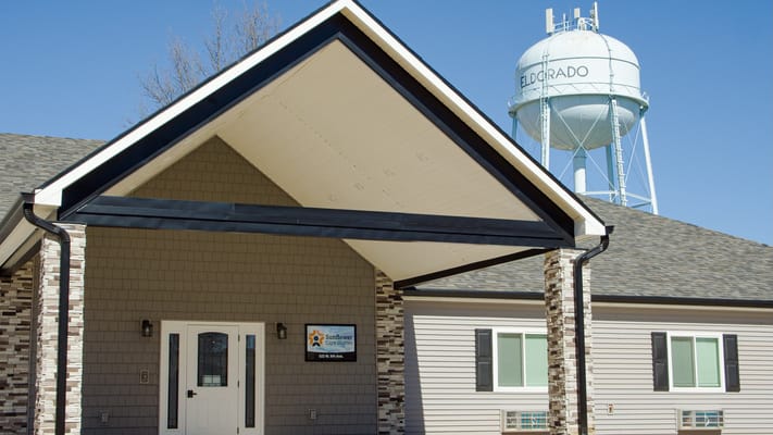 Front view of Sunflower Care Homes entrance with water tower in the background
