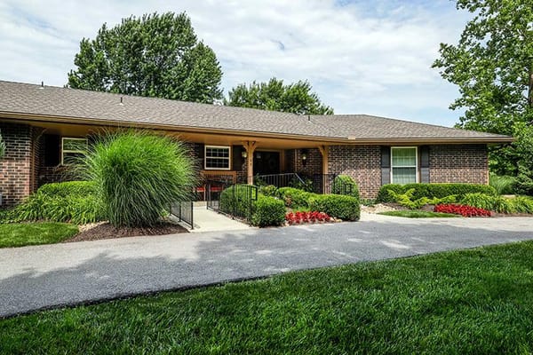 Entrance pathway lined with flowers at SeniorCare Homes