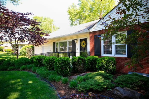 Front view of SeniorCare Homes with landscaped garden