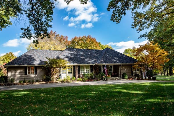 Front view of SeniorCare Homes surrounded by colorful autumn trees