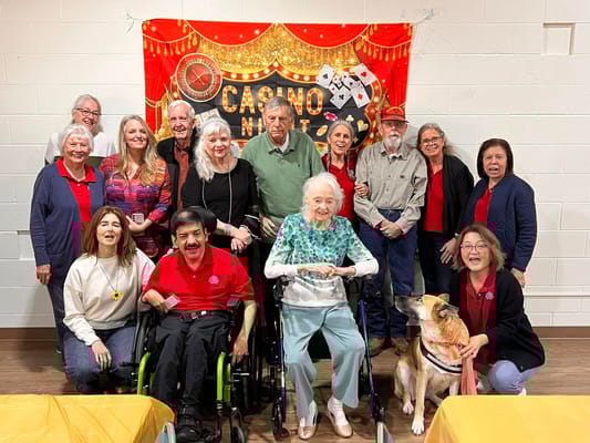 Residents and staff gather for a photo during Casino Night at Connect Camp.