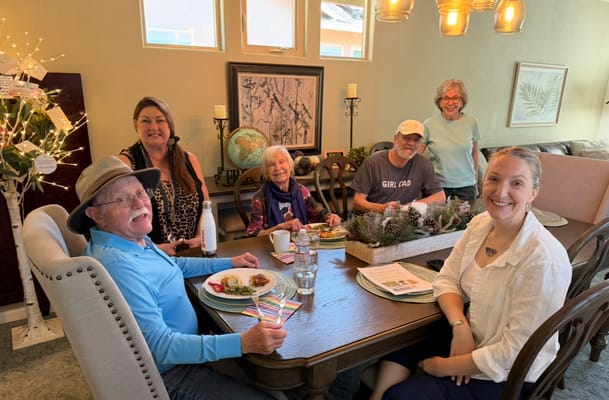 Residents enjoying a meal together in a dining room
