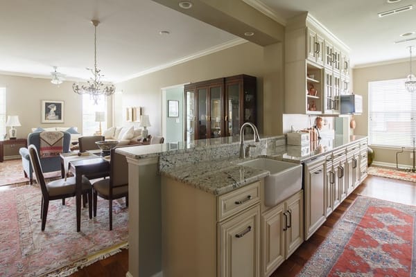Open concept living room and kitchen featuring a large island and dining area.