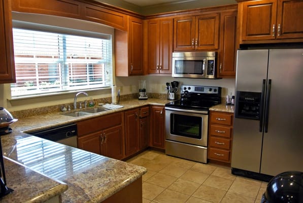 Modern kitchen with wooden cabinets and appliances