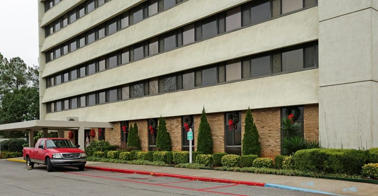 Exterior view of the Presbyterian Apartments building decorated for the holidays