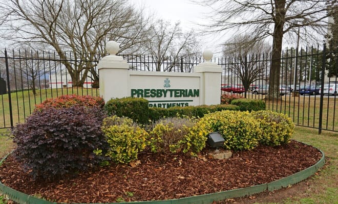 Signage for Presbyterian Apartments Inc with landscaped area