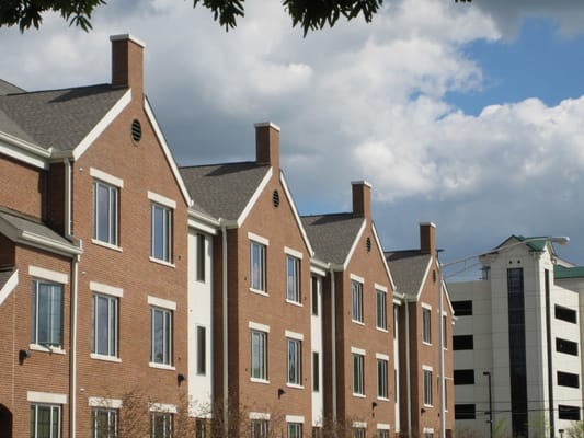 Brick facade of Gateway Place Apartments with nearby building