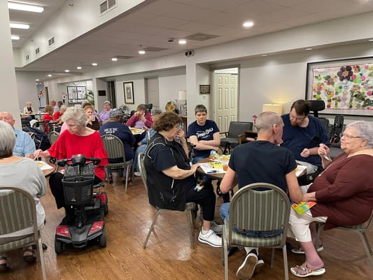 Residents enjoying a meal in the common dining area