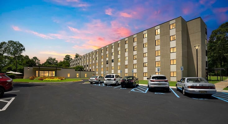 View of Seton Haven's exterior and parking lot at sunset