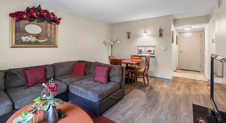 Comfortable living room with a sectional sofa and dining area