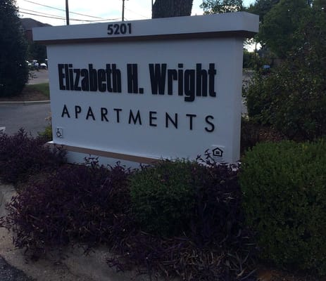 Sign for Elizabeth H. Wright Apartments outside a building