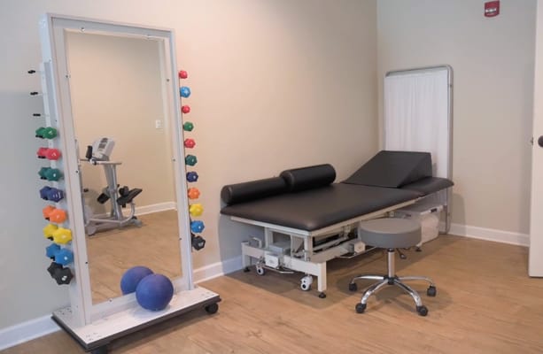 Interior of a therapy room with fitness equipment