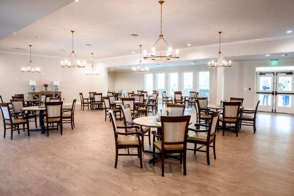Bright dining room with tables and chairs