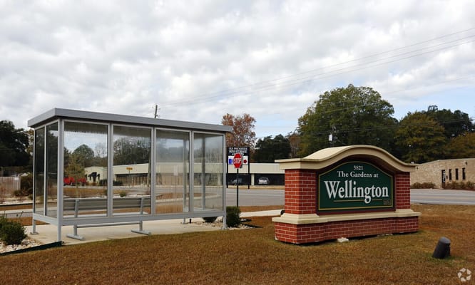 Exterior view of the Gardens at Wellington entrance and sign