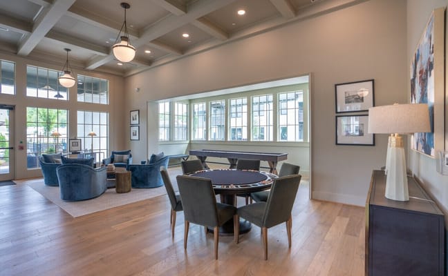 Interior common area with seating and a game table