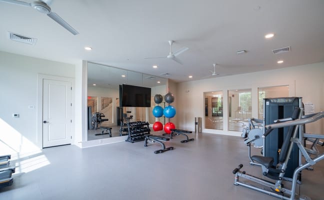 Interior view of a fitness room with exercise equipment