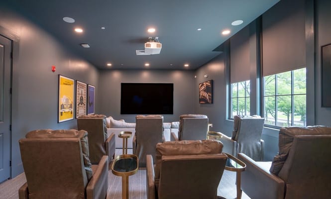 Interior view of a cozy media room with seating