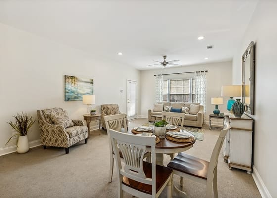 Stylish living room with a dining area and natural light