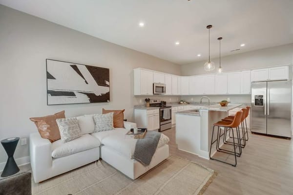 Modern kitchen and living room setup in a facility