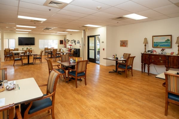 Bright dining area with tables and chairs
