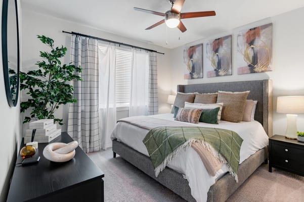 Comfortable bedroom with stylish decor and natural light