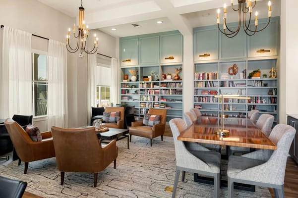 Bright common area with seating and bookshelves