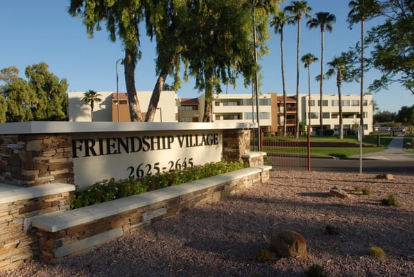 Exterior view of Friendship Village with signage
