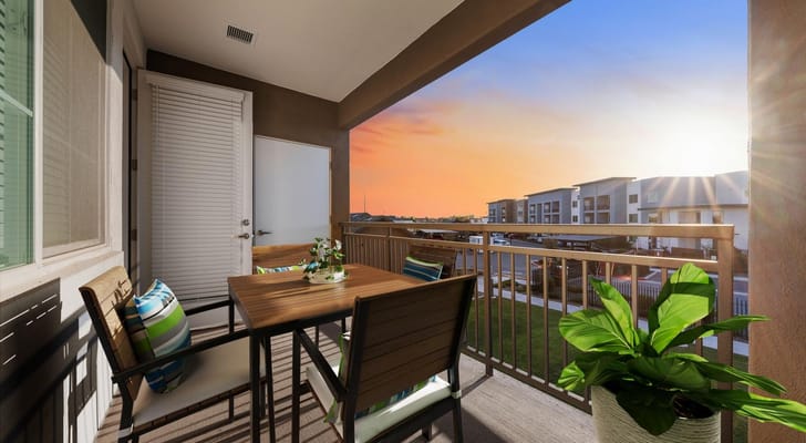 Balcony view of a senior living facility at sunset