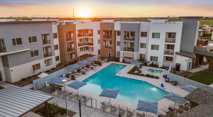 Aerial view of a modern assisted living facility with a pool