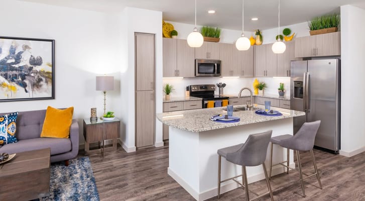 Bright and modern kitchen with granite countertops and stylish decor