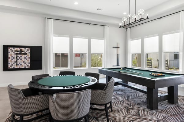 Relaxing gaming room with a pool table and card table