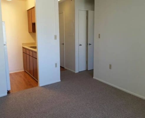 Interior view of a room with kitchen area