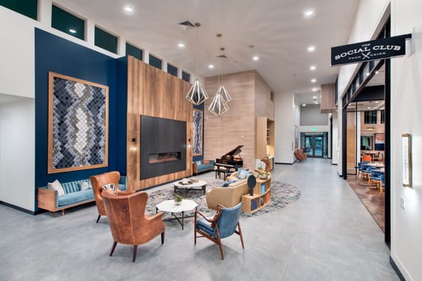 Modern lobby with seating and a piano