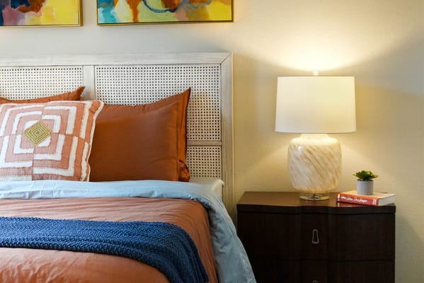 Cozy private bedroom with bedside lamp and decor