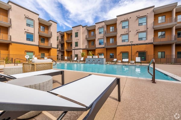 View of a pool area surrounded by the facility buildings