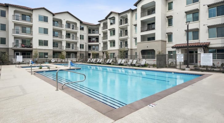 Swimming pool surrounded by the building's exterior