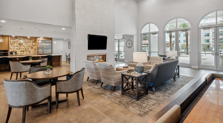 Bright common area with seating and decorative plants