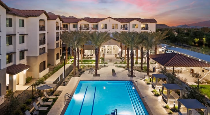 Aerial view of the facility with swimming pool and palm trees