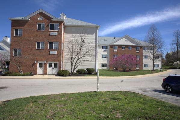 Exterior view of a senior living building with landscaping