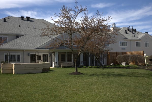 Exterior view of a senior living facility with outdoor space