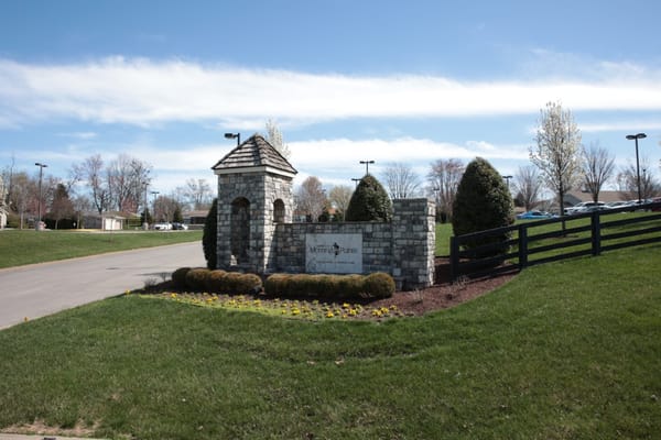 Entrance sign with flower beds at Morning Pointe Senior Living