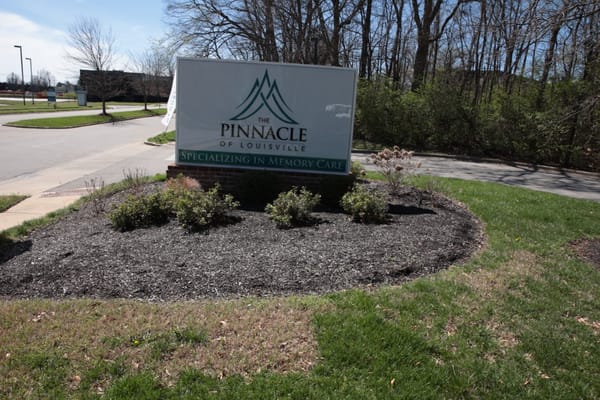 Sign for The Pinnacle of Louisville with landscaping