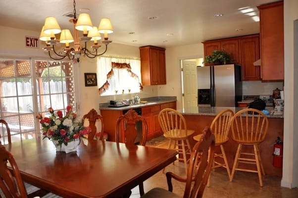 Bright kitchen and dining area with wooden furniture