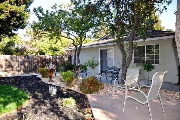 Quiet outdoor space with seating and landscaping