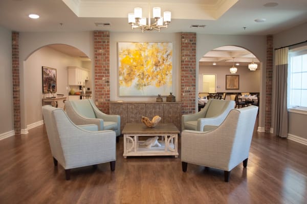 Bright common area with seating and artwork